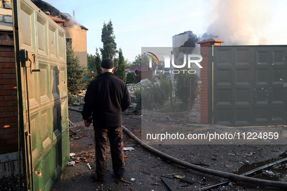 A senior man is looking at the damage caused by a Russian missile attack in Kharkiv, northeastern Ukraine, on May 10, 2024. During the night...