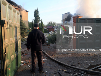 A senior man is looking at the damage caused by a Russian missile attack in Kharkiv, northeastern Ukraine, on May 10, 2024. During the night...