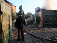 A senior man is looking at the damage caused by a Russian missile attack in Kharkiv, northeastern Ukraine, on May 10, 2024. During the night...