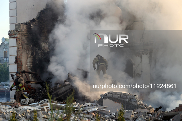 Rescuers are working at a house in Kharkiv, Ukraine, on May 10, 2024, after a Russian missile attack. During the night of May 10, Russian fo...