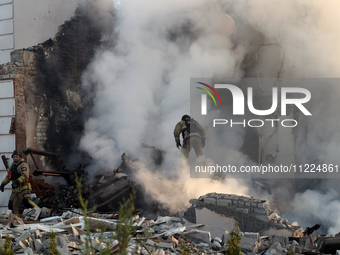 Rescuers are working at a house in Kharkiv, Ukraine, on May 10, 2024, after a Russian missile attack. During the night of May 10, Russian fo...