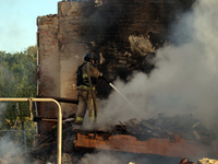 A firefighter is suppressing a fire caused by a Russian missile attack in Kharkiv, northeastern Ukraine, on May 10, 2024. On the night of Ma...