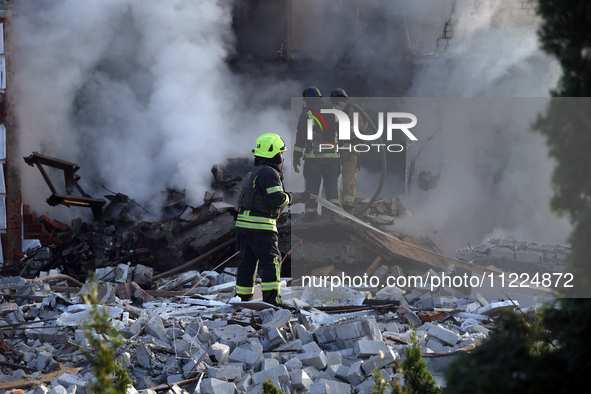 Rescuers are working at a house in Kharkiv, Ukraine, on May 10, 2024, after a Russian missile attack. During the night of May 10, Russian fo...