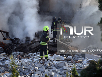 Rescuers are working at a house in Kharkiv, Ukraine, on May 10, 2024, after a Russian missile attack. During the night of May 10, Russian fo...