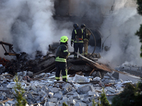 Rescuers are working at a house in Kharkiv, Ukraine, on May 10, 2024, after a Russian missile attack. During the night of May 10, Russian fo...