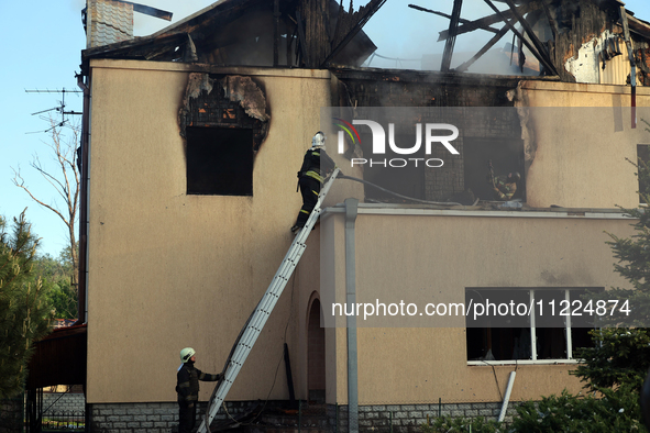 Rescuers are working at a house in Kharkiv, Ukraine, on May 10, 2024, after a Russian missile attack. During the night of May 10, Russian fo...