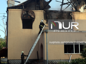 Rescuers are working at a house in Kharkiv, Ukraine, on May 10, 2024, after a Russian missile attack. During the night of May 10, Russian fo...