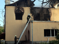 Rescuers are working at a house in Kharkiv, Ukraine, on May 10, 2024, after a Russian missile attack. During the night of May 10, Russian fo...