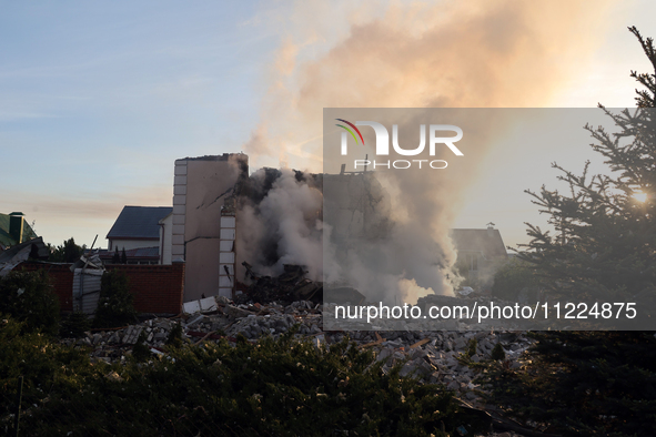 Smoke is rising over a house in Kharkiv, Ukraine, on May 10, 2024, after a Russian missile attack. Russian forces are attacking Kharkiv with...