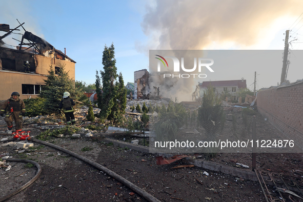 Rescuers are working at a house in Kharkiv, Ukraine, on May 10, 2024, after a Russian missile attack. During the night of May 10, Russian fo...