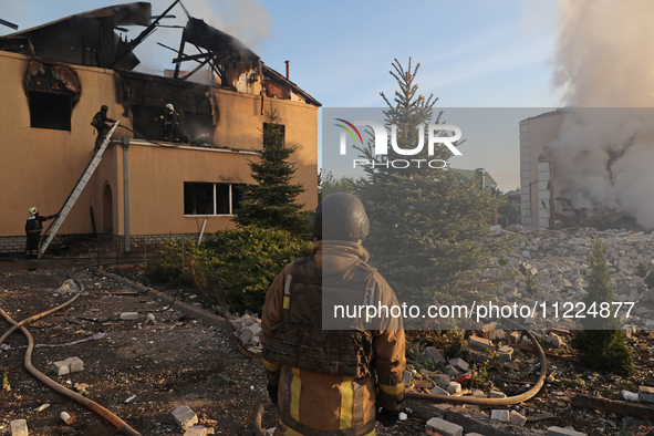 Rescuers are working at a house in Kharkiv, Ukraine, on May 10, 2024, after a Russian missile attack. During the night of May 10, Russian fo...