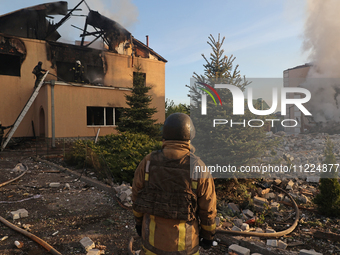 Rescuers are working at a house in Kharkiv, Ukraine, on May 10, 2024, after a Russian missile attack. During the night of May 10, Russian fo...