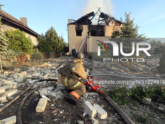 Rescuers are working at a house in Kharkiv, Ukraine, on May 10, 2024, after a Russian missile attack. During the night of May 10, Russian fo...