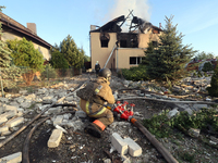 Rescuers are working at a house in Kharkiv, Ukraine, on May 10, 2024, after a Russian missile attack. During the night of May 10, Russian fo...