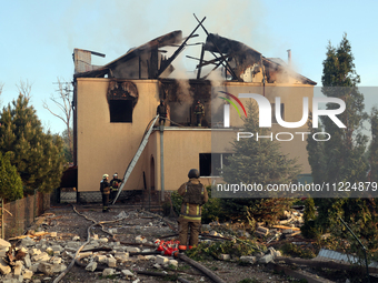 Rescuers are working at a house in Kharkiv, Ukraine, on May 10, 2024, after a Russian missile attack. During the night of May 10, Russian fo...