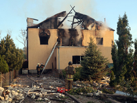 Rescuers are working at a house in Kharkiv, Ukraine, on May 10, 2024, after a Russian missile attack. During the night of May 10, Russian fo...