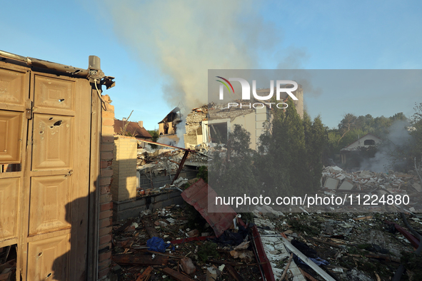 Smoke is rising over a house after a Russian missile attack in Kharkiv, northeastern Ukraine, on May 10, 2024. On the night of May 10, Russi...