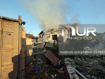 Smoke is rising over a house after a Russian missile attack in Kharkiv, northeastern Ukraine, on May 10, 2024. On the night of May 10, Russi...