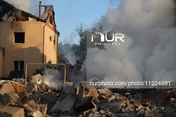 Rescuers are working at a house in Kharkiv, Ukraine, on May 10, 2024, after a Russian missile attack. During the night of May 10, Russian fo...