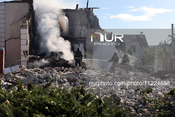 Rescuers are working at a house in Kharkiv, Ukraine, on May 10, 2024, after a Russian missile attack. During the night of May 10, Russian fo...