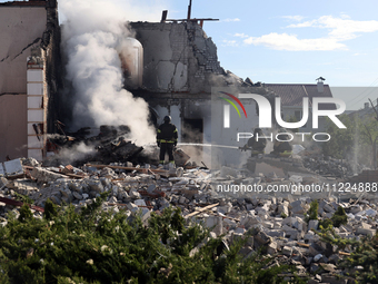 Rescuers are working at a house in Kharkiv, Ukraine, on May 10, 2024, after a Russian missile attack. During the night of May 10, Russian fo...