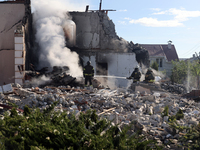 Rescuers are working at a house in Kharkiv, Ukraine, on May 10, 2024, after a Russian missile attack. During the night of May 10, Russian fo...