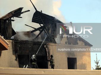 Rescuers are working at a house in Kharkiv, Ukraine, on May 10, 2024, after a Russian missile attack. During the night of May 10, Russian fo...