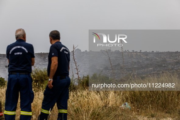 Members of the fire department are watching for possible resurgence in Limassol, Cyprus, on May 10, 2024. The wildfire, which broke out yest...