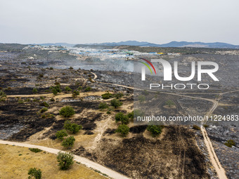 An aerial view shows the burned area in Limassol, Cyprus, on May 10, 2024. A wildfire is burning mostly wild vegetation over a six square ki...