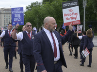 American Airlines flight attendants are picketing nationwide to demand their right to strike, an important step in securing a new contract w...