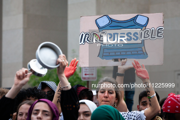 Hundreds of pro-Palestinian students and supporters rally at the site of their Gaza solidarity encampment the day after police cleared the c...