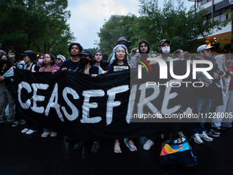 Pro-Palestinian students rally outside the office of George Washington University President Ellen Granberg, Washjngton, DC, May 9, 2024.  Po...