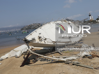 Boats are lying destroyed and abandoned on the shore of Tamarindos Beach in Acapulco, Guerrero, six months after Hurricane Otis struck, impa...