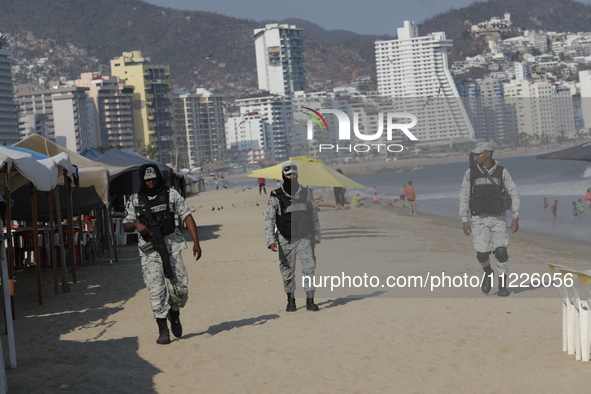 Members of the National Guard are monitoring the hotel zone of Tamarindos Beach in Acapulco, Guerrero, on April 17, 2024, six months after H...