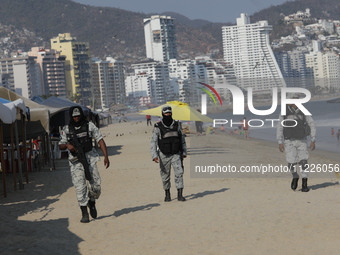 Members of the National Guard are monitoring the hotel zone of Tamarindos Beach in Acapulco, Guerrero, on April 17, 2024, six months after H...