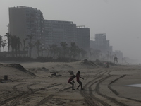 Tourists are enjoying the beach while hotels appear destroyed at Riviera Punta Diamante in Acapulco, Guerrero, six months after Hurricane Ot...