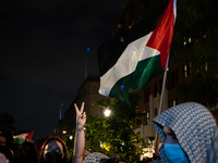 Pro-Palestinian students and their supporters rally outside the office of George Washington University president Ellen Granberg, Washington,...