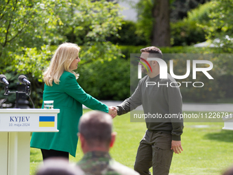 Presidents Volodymyr Zelenskyy of Ukraine and Zuzana Caputova of Slovakia are shaking hands during a joint briefing in Kyiv, Ukraine, on May...