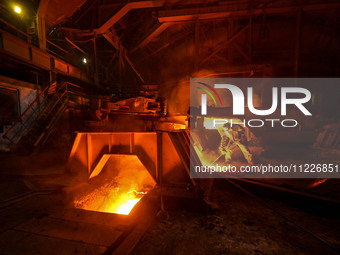 A worker is performing his duties in a blast furnace shop at Zaporizhstal Iron and Steel Works in Zaporizhzhia, Ukraine, on May 3, 2024. (