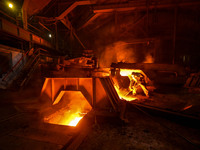 A worker is performing his duties in a blast furnace shop at Zaporizhstal Iron and Steel Works in Zaporizhzhia, Ukraine, on May 3, 2024. (