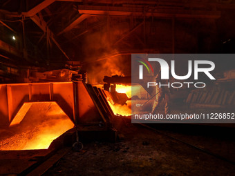 A worker is performing his duties in a blast furnace shop at Zaporizhstal Iron and Steel Works in Zaporizhzhia, Ukraine, on May 3, 2024. (