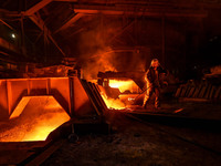 A worker is performing his duties in a blast furnace shop at Zaporizhstal Iron and Steel Works in Zaporizhzhia, Ukraine, on May 3, 2024. (