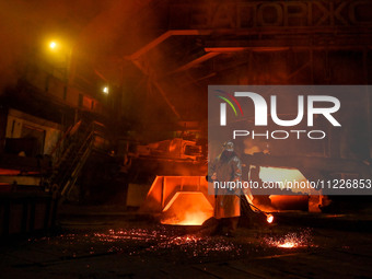 A worker is performing his duties in a blast furnace shop at Zaporizhstal Iron and Steel Works in Zaporizhzhia, Ukraine, on May 3, 2024. (