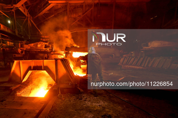 A worker is performing his duties in a blast furnace shop at Zaporizhstal Iron and Steel Works in Zaporizhzhia, Ukraine, on May 3, 2024. 