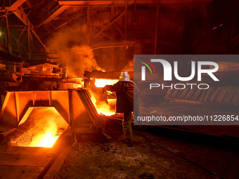 A worker is performing his duties in a blast furnace shop at Zaporizhstal Iron and Steel Works in Zaporizhzhia, Ukraine, on May 3, 2024. (