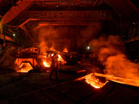 A worker is performing his duties in a blast furnace shop at Zaporizhstal Iron and Steel Works in Zaporizhzhia, Ukraine, on May 3, 2024. (