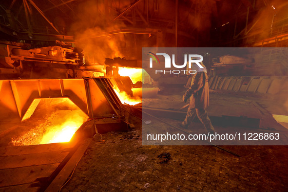 A worker is performing his duties in a blast furnace shop at Zaporizhstal Iron and Steel Works in Zaporizhzhia, Ukraine, on May 3, 2024. 