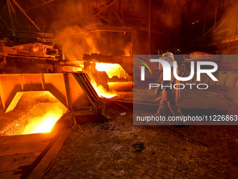 A worker is performing his duties in a blast furnace shop at Zaporizhstal Iron and Steel Works in Zaporizhzhia, Ukraine, on May 3, 2024. (