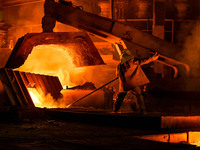 A worker is performing his duties in a blast furnace shop at Zaporizhstal Iron and Steel Works in Zaporizhzhia, Ukraine, on May 3, 2024. (