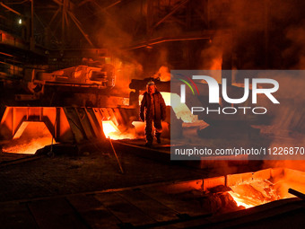 A worker is performing his duties in a blast furnace shop at Zaporizhstal Iron and Steel Works in Zaporizhzhia, Ukraine, on May 3, 2024. (